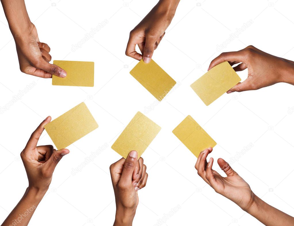 Black male hand with golden business cards. Set, isolated on white.