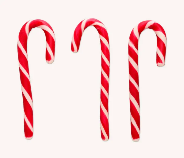 Red and white christmas candy canes isolated on white — Stock Photo, Image