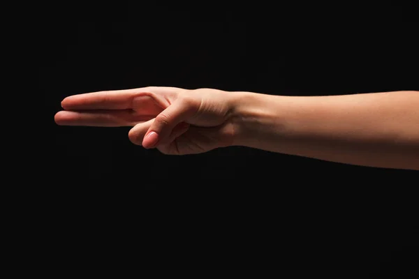 Γυναικείο χέρι δείχνει τον αριθμό δύο απομονωμένες στο μαύρο — Φωτογραφία Αρχείου
