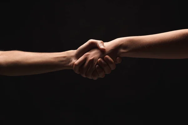 Mãos de homem e mulher apaixonados, isolados em preto — Fotografia de Stock