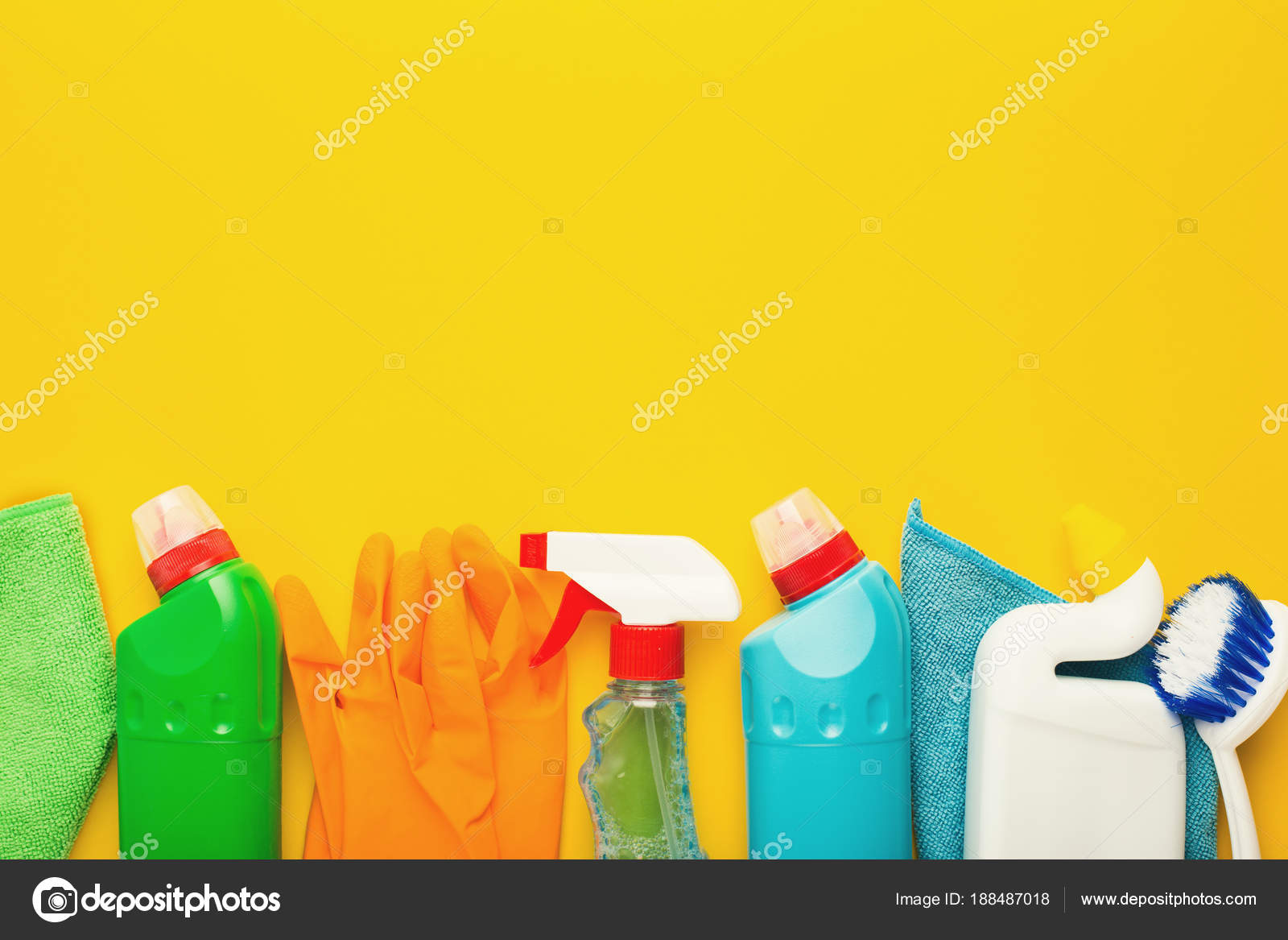 Premium Photo  Cleaning supplies closeup on the background of the bathroom  in yellow colors