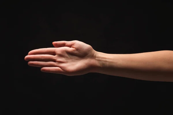 Hand isoliert auf schwarzem Hintergrund — Stockfoto