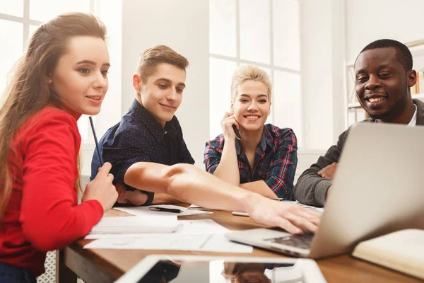 Multiethnic classmates preparing for exams together — Stock Photo, Image