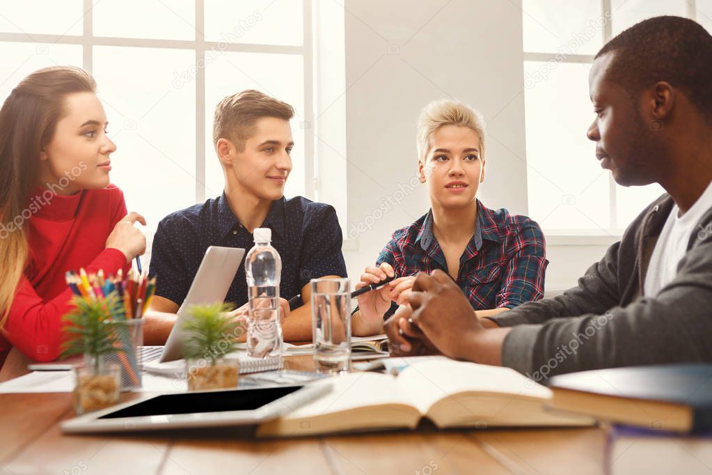 Multiethnic classmates preparing for exams together