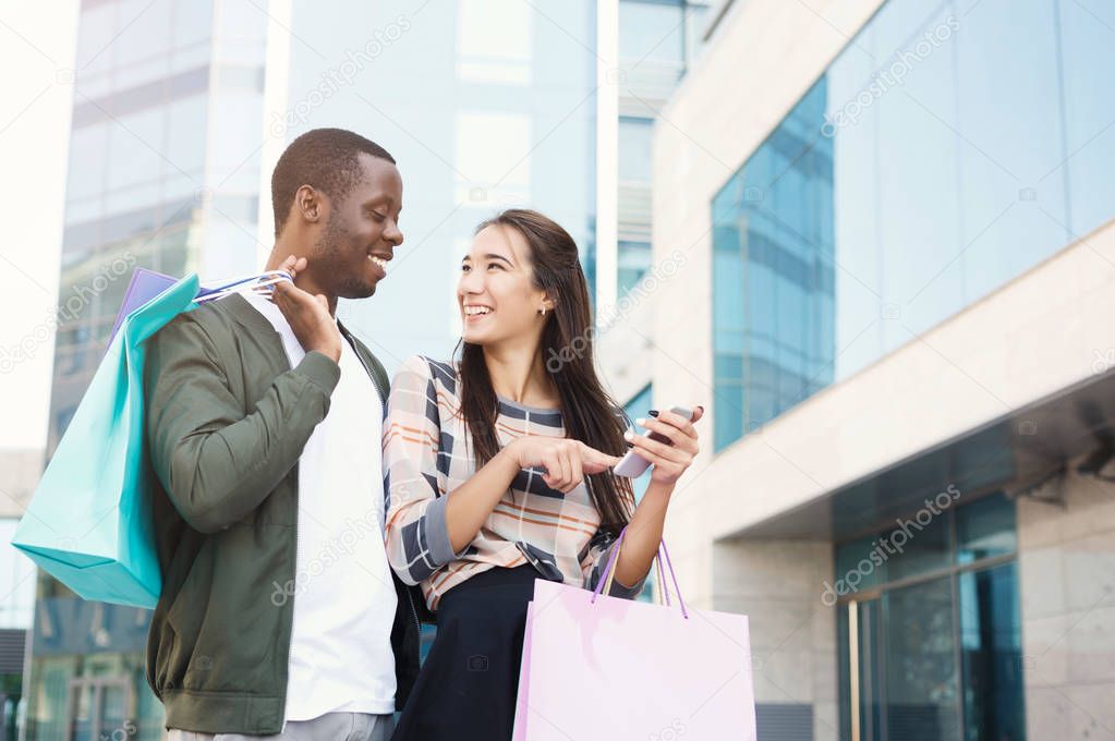 Multiethnic couple shopping together