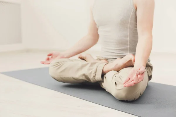 Young man in yoga class, relax meditation pose — Stock Photo, Image