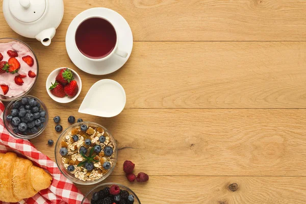 Rich breakfast on natural wooden table — Stock Photo, Image