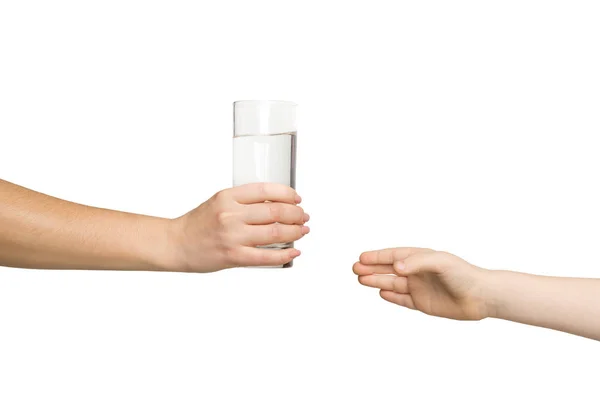 Woman giving glass of water to kid, isolated — Stock Photo, Image