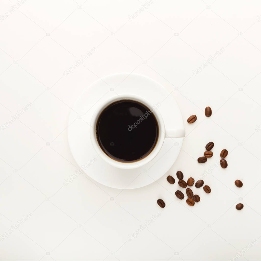 Black coffee cup and roasted beans isolated on white