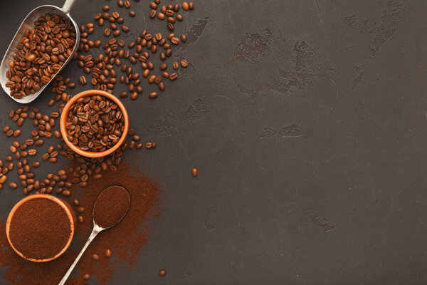 Top view on scattered coffee beans and spices, background with c