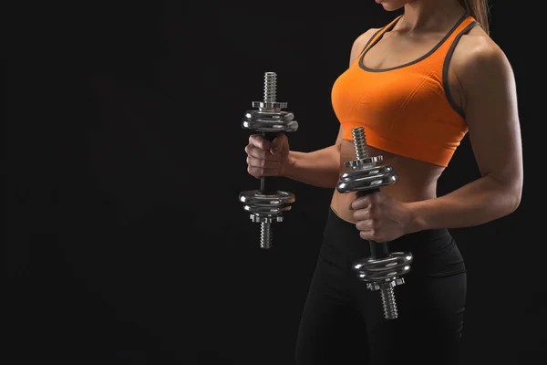 Unrecognizable athletic woman with dumbbells — Stock Photo, Image