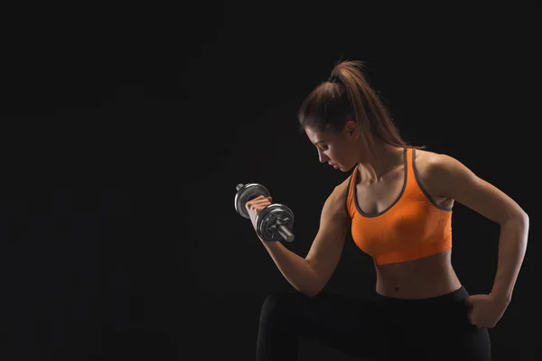 Athletic woman with dumbbell — Stock Photo, Image