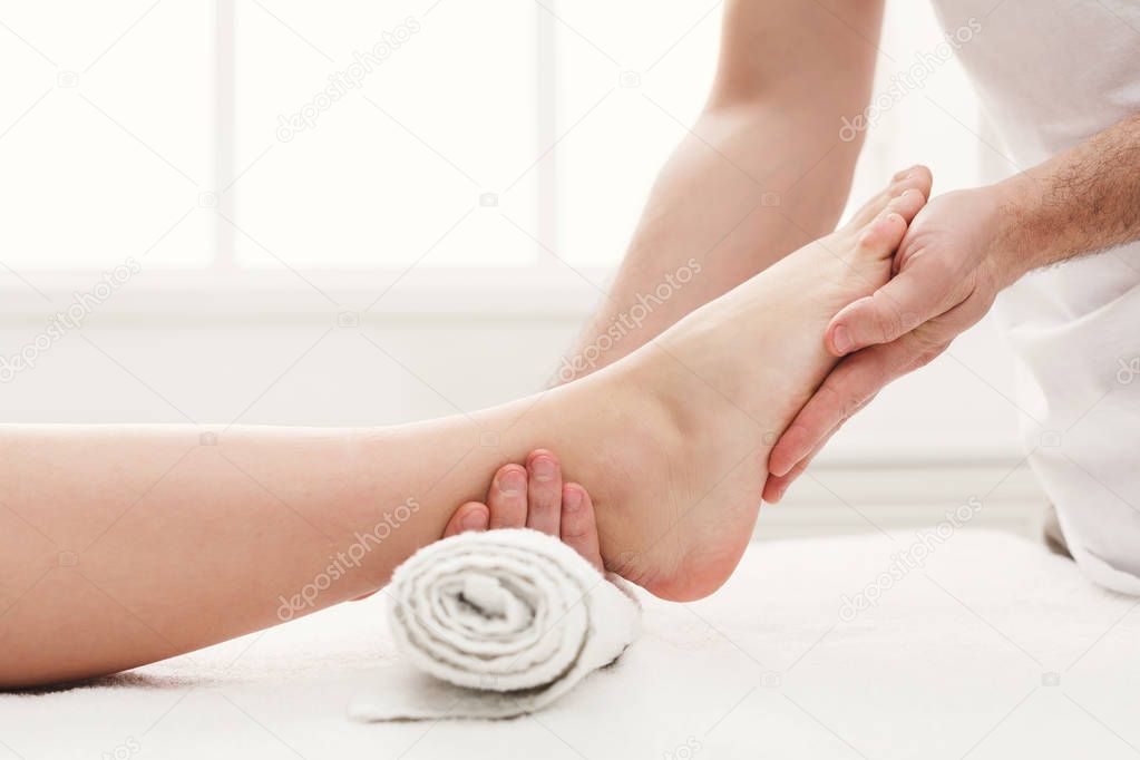 Feet massage closeup, acupressure