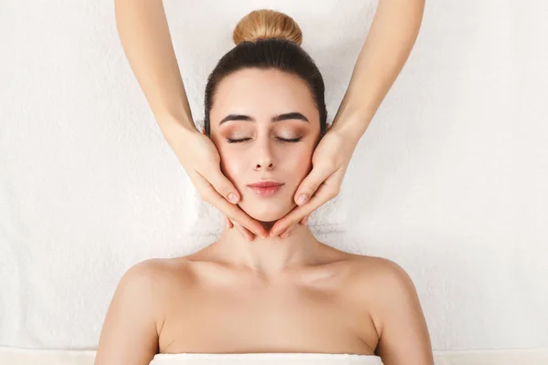 Woman getting professional facial massage at spa — Stock Photo, Image