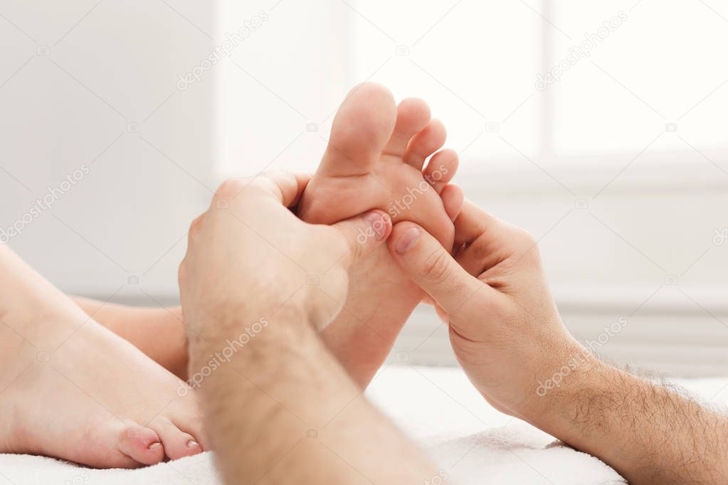 Feet massage closeup, acupressure