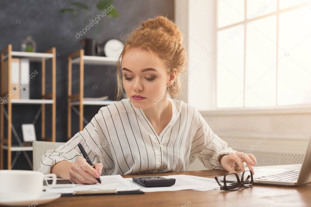 Financier woman working at office desktop