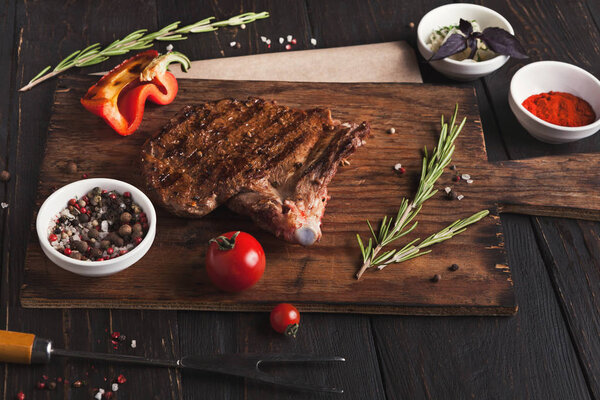 Grilled meat and vegetables on rustic wooden table