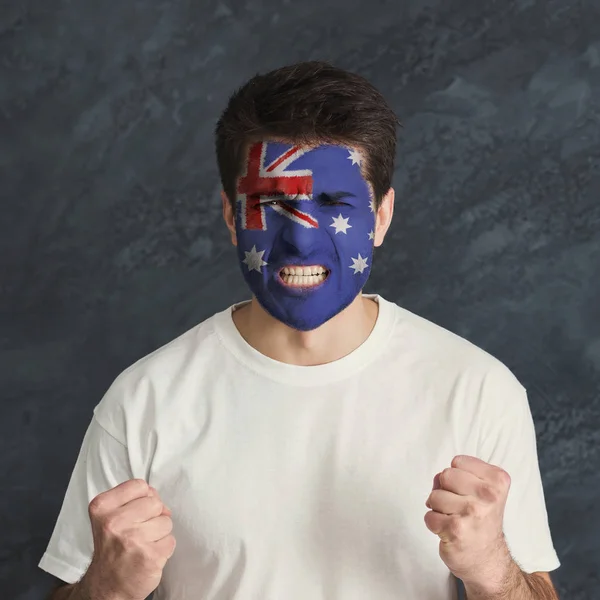 Young man with Australia flag painted on his face — Stock Photo, Image