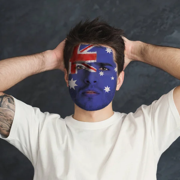 Young man with Australia flag painted on his face — Stock Photo, Image