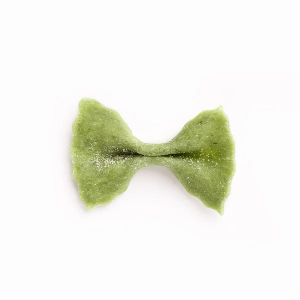 One green farfalle pasta isolated on white — Stock Photo, Image