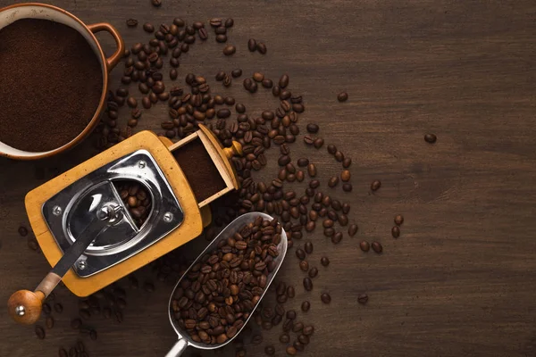 Retro coffee grinder on old wooden table, top view — Stock Photo, Image