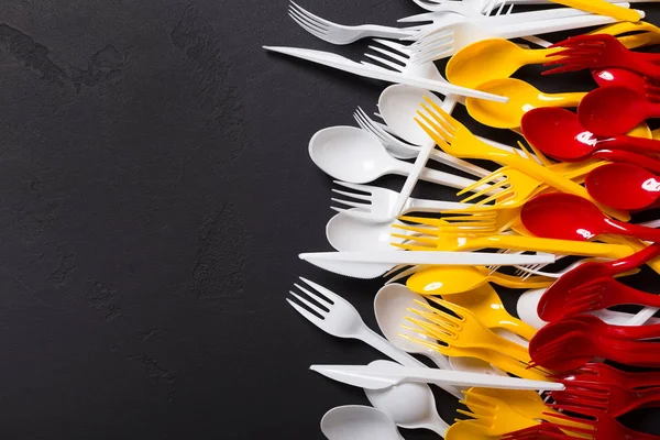 Top view on plastic forks at black background — Stock Photo, Image