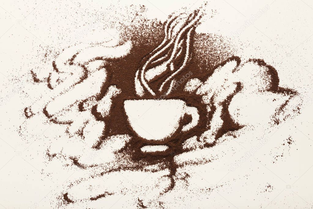 Drawing with ground coffee - cup and smoke, top view