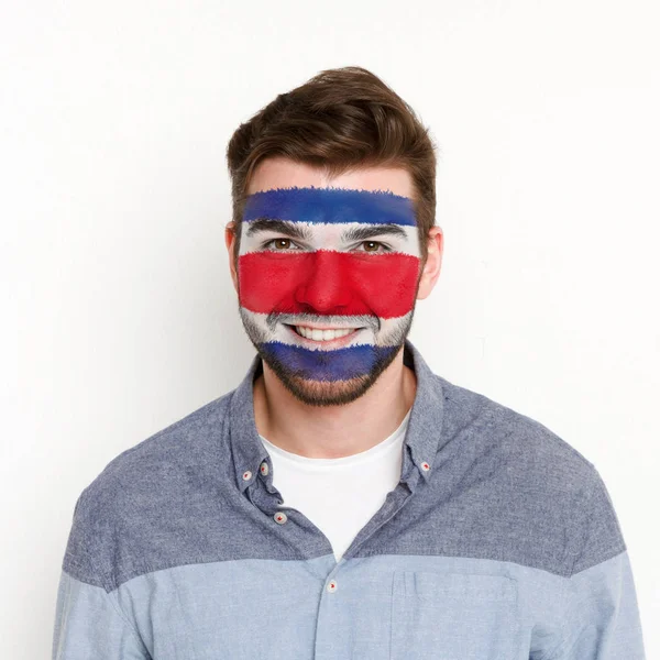ชายหนุ่มที่มีธงคอสตาริกา สีบนใบหน้าของเขา — ภาพถ่ายสต็อก