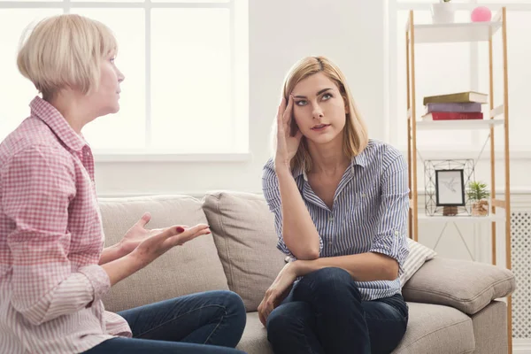 Portrait of angry adult woman and daughter at home — Stock Photo, Image