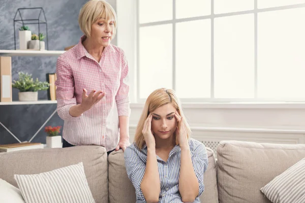 Portrait of angry adult woman and daughter at home — Stock Photo, Image