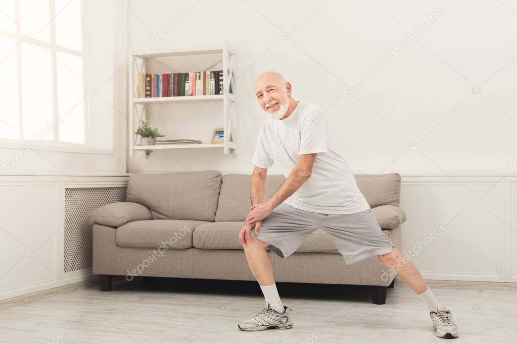 Senior man warmup stretching training indoors