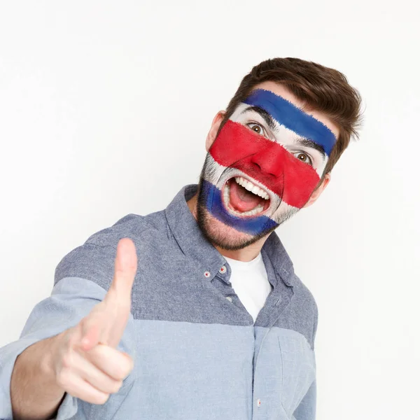 Jovem com bandeira da Costa Rica pintada em seu rosto — Fotografia de Stock