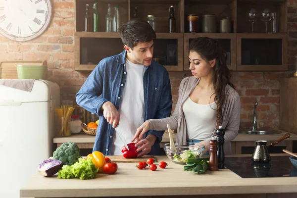 Happy couple cooking dinner together — Stock Photo, Image