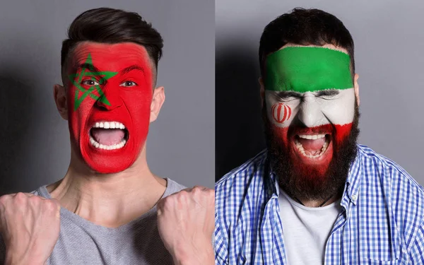 Emotional soccer fans with painted flags on faces — Stock Photo, Image