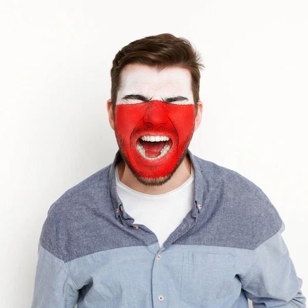 Jonge man met Polen vlag geschilderd op zijn gezicht — Stockfoto
