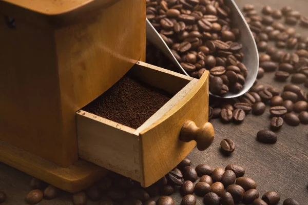 Retro coffee grinder on old wooden table, closeup — Stock Photo, Image