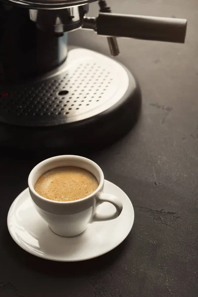 Brewing coffee in professional machine, closeup