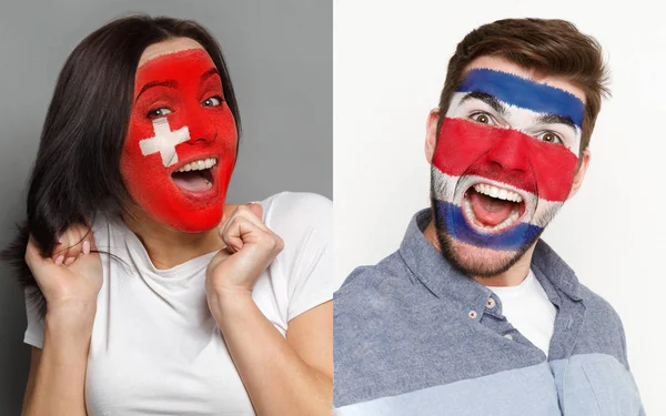 Emotionele voetbalfans met geschilderde vlaggen op gezichten — Stockfoto
