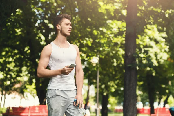 Man choose music to listen during workout