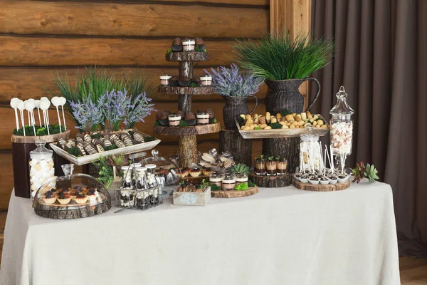 Dessert table for any holiday at wooden background — Stock Photo, Image