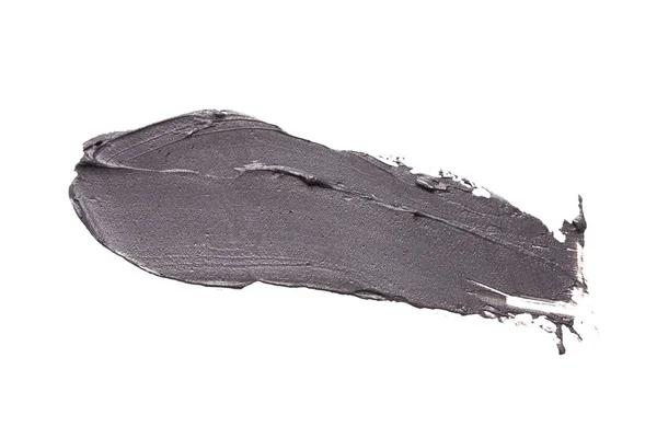 Маска из черной глины на белом изолированном фоне — стоковое фото