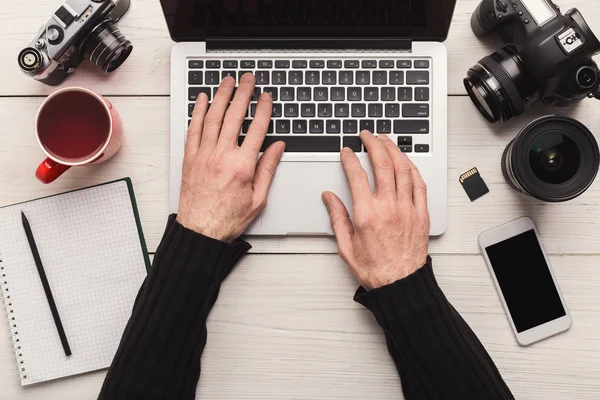 Photographer using laptop on workplace — Stock Photo, Image