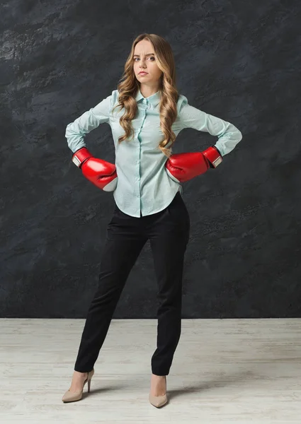 Woman in red boxing glove punch to the goal