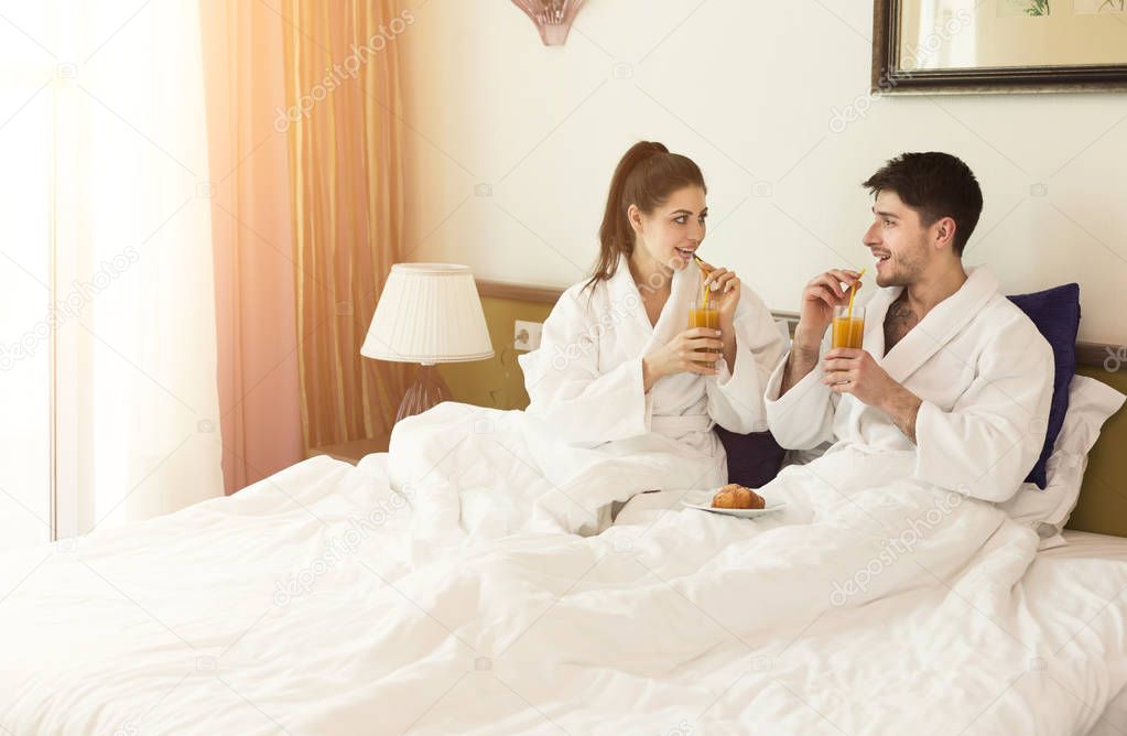 Beautiful young couple relaxing in hotel