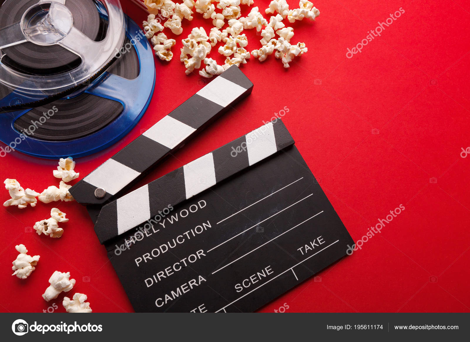 Clapperboard, film reel and popcorn on red background — Stock Photo ©  Milkos #195611174