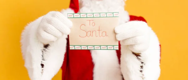 Time for writing letter to Santa with Christmas wishes on orange — Stock Photo, Image