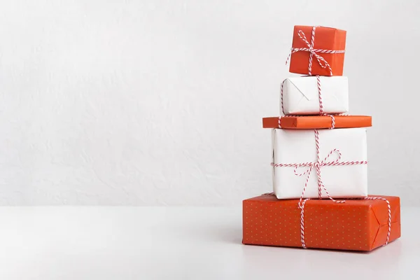 Gift boxes packed in craft colored paper — Stock Photo, Image