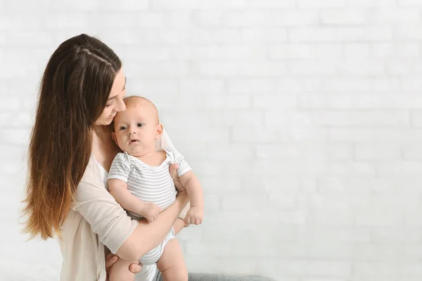 Sweet little baby in young mothers hands — Stock Photo, Image