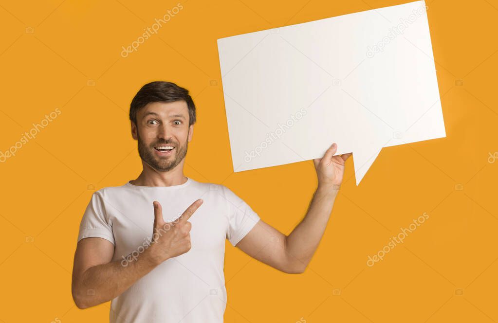 Shocked Guy Showing Speech Bubble Pointing Finger Standing In Studio