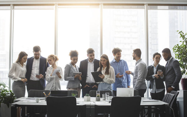 Diverse business team discussing work during break